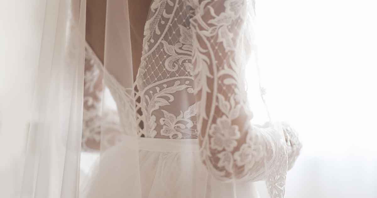 A bride in a white wedding dress with a veil.