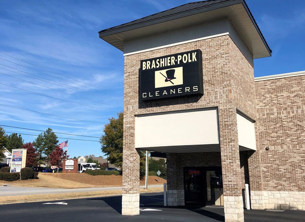 A brick building with a sign for 